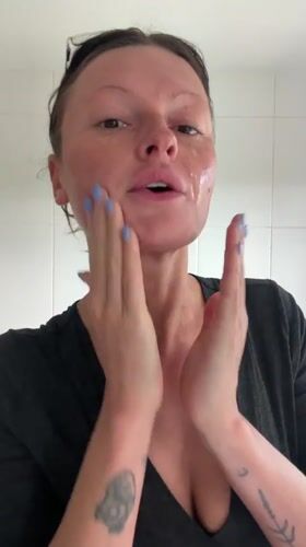 Woman applies makeup in Tunbridge Wells bathroom