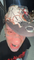 Tattooed man films self with phone in Buenos Aires