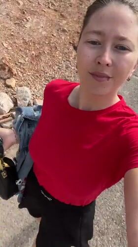 Woman films selfie video while walking Podgorica street