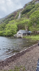 Visitor documents overcast lake scenery near Beddgelert, Wales