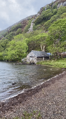 Visitor documents overcast lake scenery near Beddgelert, Wales