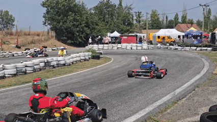 Go-kart racing event at a sunny outdoor circuit