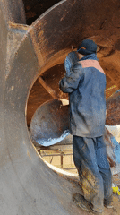Ship maintenance underway on rusted propeller in Russia
