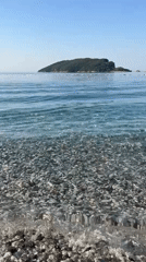 Calm morning on a pebble beach in Budva, Montenegro