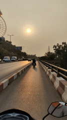 Motorcycle riders travel through Hong Gai Ward streets
