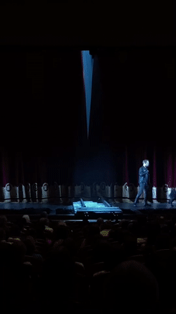 Guitarist performs under spotlight in Russian theater
