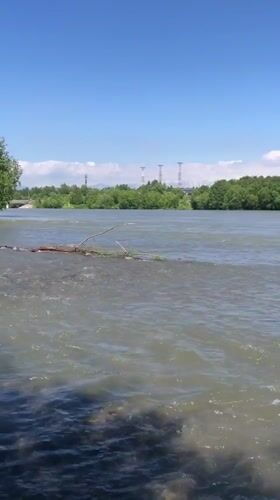 Muddy river views near Yelizovo with a volcano looming behind