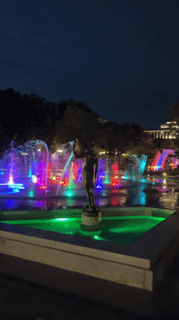 Colorful fountain displays illuminate Yerevan night with bronze sculptures