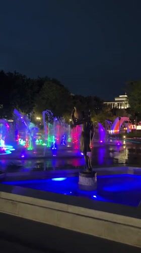 Colorful fountain displays illuminate Yerevan night with bronze sculptures