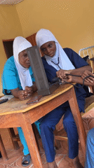 Healthcare workers conduct blood pressure checks in Madangala clinic