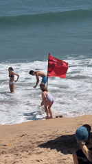 Kuta Beach surf and shoreline on a clear Bali morning