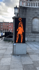 Art installation features halo-adorned pedestrian crossing sign