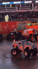 Neon-lit RC monster trucks on display at Chicago arena