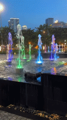 Nha Trang at dusk: fountains, street traffic, and everyday scenes