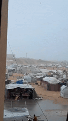Displacement camp documented in Khan Yunis from barred window