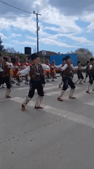 Bulgarian folk dancers perform traditional street celebration in Obrochishte