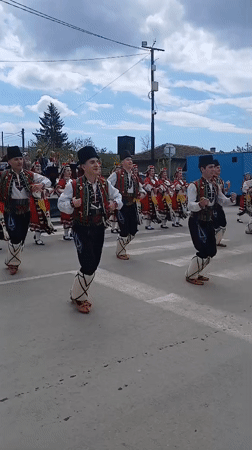 Bulgarian folk dancers perform traditional street celebration in Obrochishte