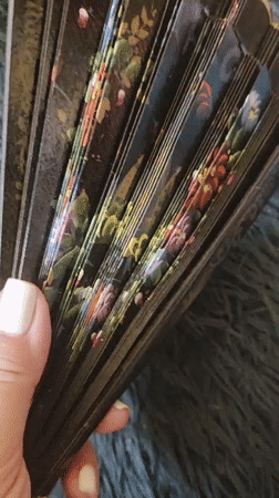 Crafting enthusiast documents lace work and fans with pets