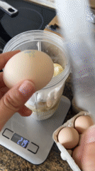 Blending buckwheat, apple, and egg into a frothy drink