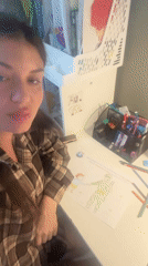 Woman photographs child's drawing of soldier in Moscow