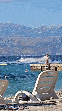 Sunny afternoon on a pebble beach in Supetar, Croatia
