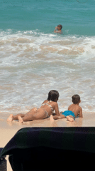 Family enjoys beach day with refreshments in Kuta Selatan