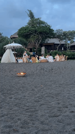 Beach gathering with fishing and dogs in Mengwi, Indonesia