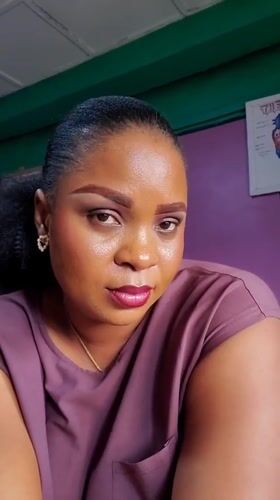 Woman photographed in Nigerian classroom with anatomy materials
