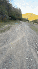 Couple documents rural walk in Buhovo, Bulgaria countryside