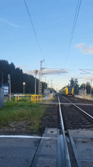 Modern passenger train cuts through rural Latvia near Iecēni