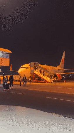 Routine passenger arrivals at Jakarta airport captured at night