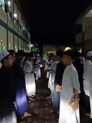 Young men gather for evening religious activities in Lhokseumawe