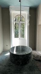 Bathroom renovation documented in Lezza featuring green marble fixtures