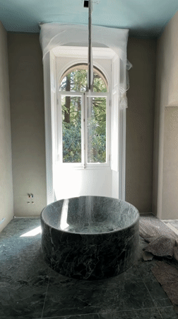 Bathroom renovation documented in Lezza featuring green marble fixtures