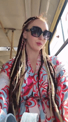 Woman gazes from bus window in Izhevsk, Russia