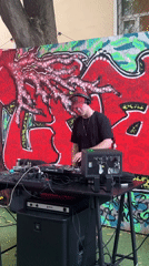 Outdoor party with live DJ set and ping pong in a courtyard