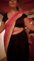 Women in traditional sarees captured spinning at location