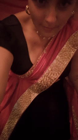 Women in traditional sarees captured spinning at location