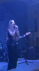 Female singer performs live with band in Krasnoyarsk