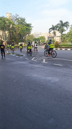 Early morning activity around Surabaya's golden monument