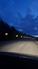 Dashcam captures twilight highway drive near Dybki, Russia
