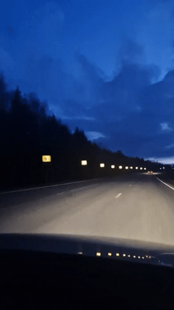 Dashcam captures twilight highway drive near Dybki, Russia