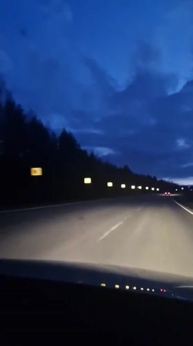 Dashcam captures twilight highway drive near Dybki, Russia