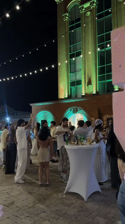 Evening event at an Armenian venue with vintage decor and festive lights