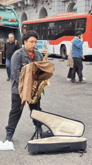 Street saxophonist performs evening set in Santiago