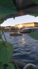 Artist displays nun dolls along Prague riverfront during evening hours