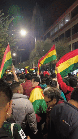 Nighttime patriotic celebrations sweep La Paz streets with flag-waving crowds