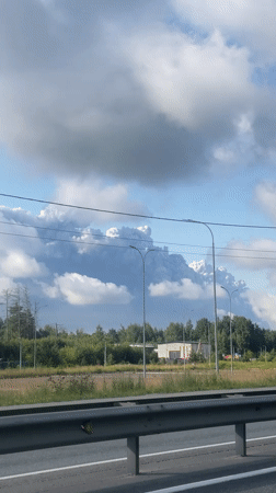 Unrelated scenes span highway, smoke plume, gas station, and gym