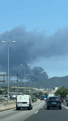 Dark smoke plume observed over busy highway in Montmeló