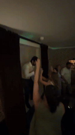 Lively indoor gathering with mic in hand, Cotswolds